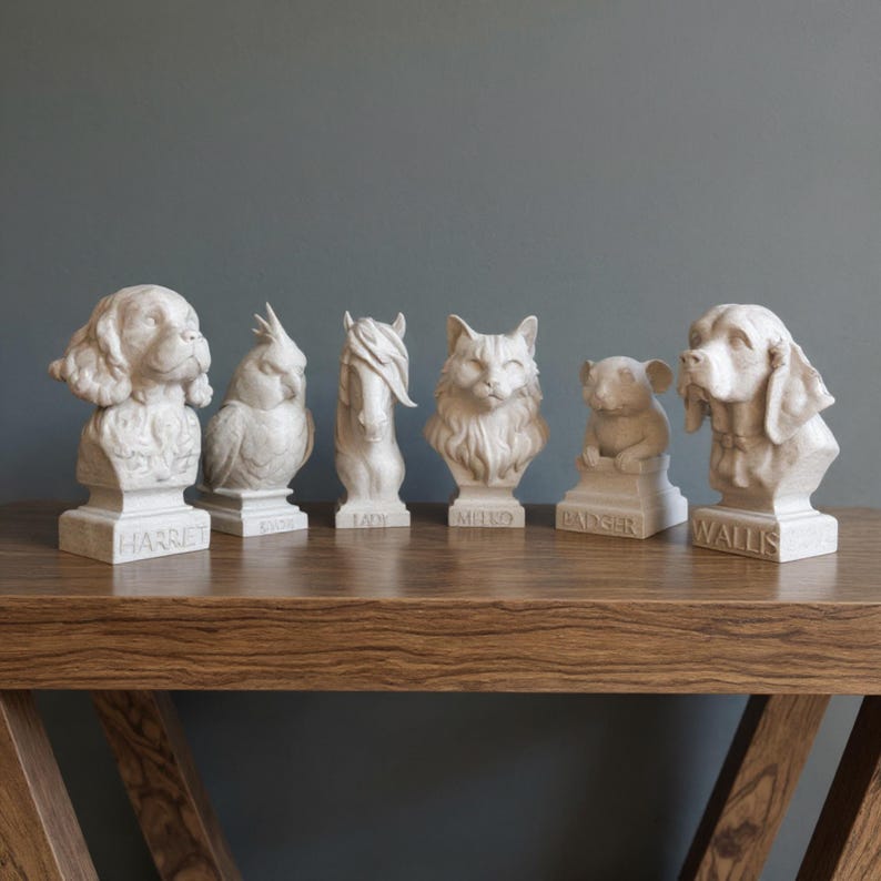 Row of personalised animal bust keepsakes including dogs, cat, horse, bird and small pet