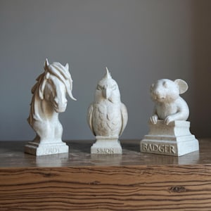 Horse, bird and small pet bust keepsakes displayed together
