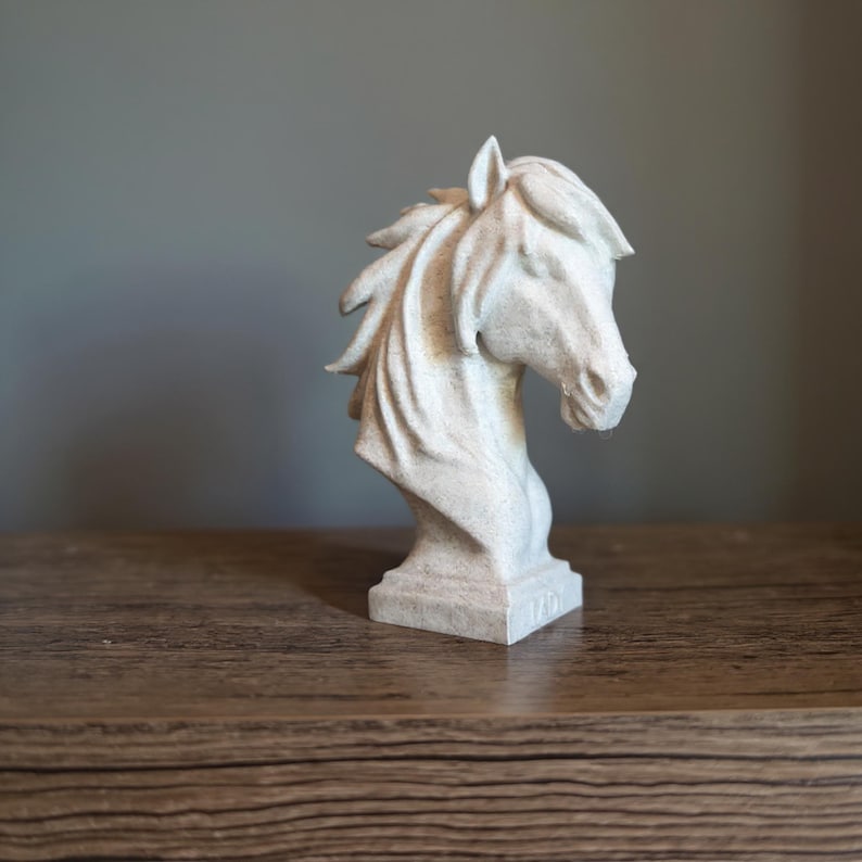 Marble-effect horse bust keepsake displayed on a wooden surface