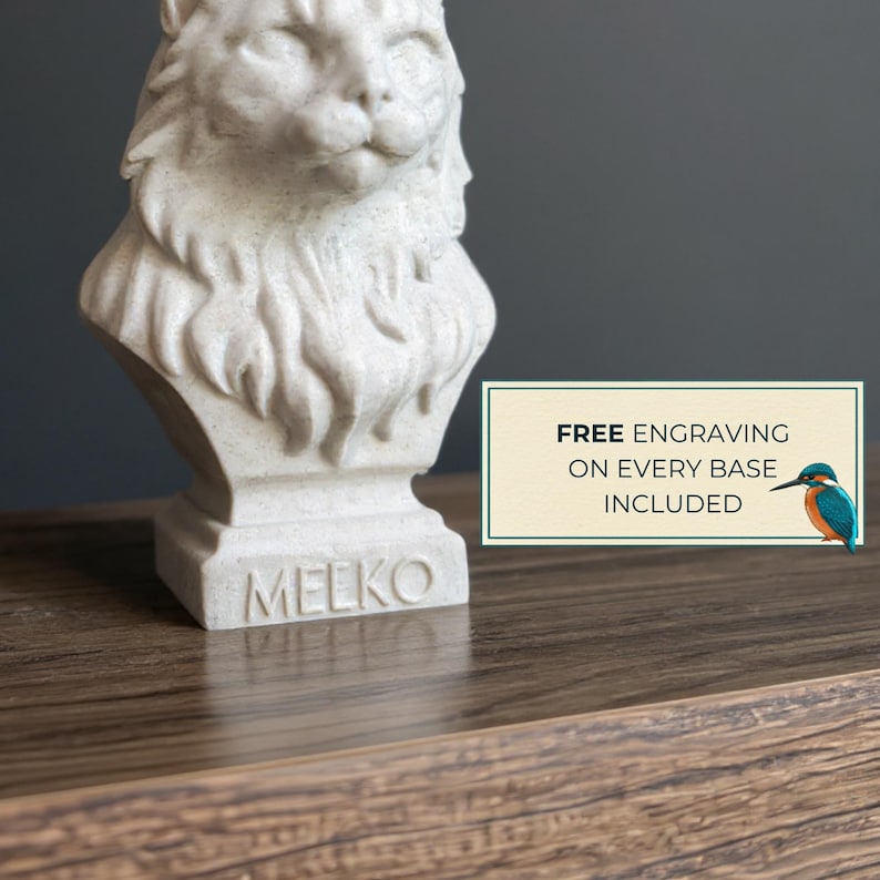 Close-up of a personalised cat bust with engraved name base