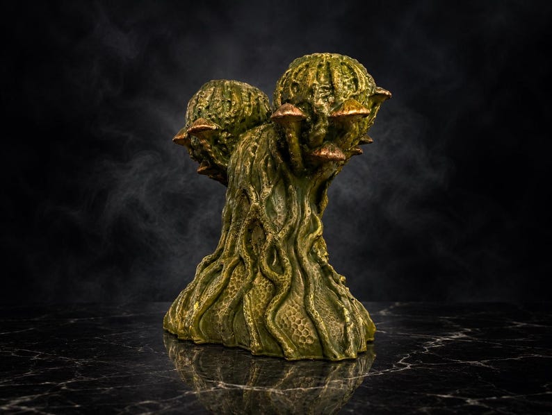 Back view of Mycelia cast stone mushroom head planter with root-like detail