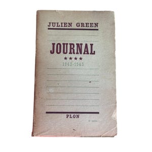 May include: A vintage softcover book titled Journal 1943-1945 by Julien Green, published by Plon. The cover is a light beige color with dark brown text, horizontal lines, and four small stars centered below the title. The edges show wear.