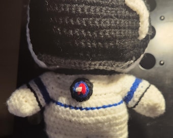 Weebee doll in astronaut uniform.