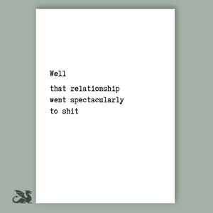 May include: A white rectangular print with the text "Well that relationship went spectacularly to shit" in a typewriter font. A small dragon illustration is in the lower left corner. The background is a muted green.