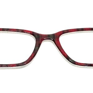 May include: Eyeglasses with a rectangular frame. The frame has a red and black plaid pattern. The lenses are clear, and the glasses are set against a white background.