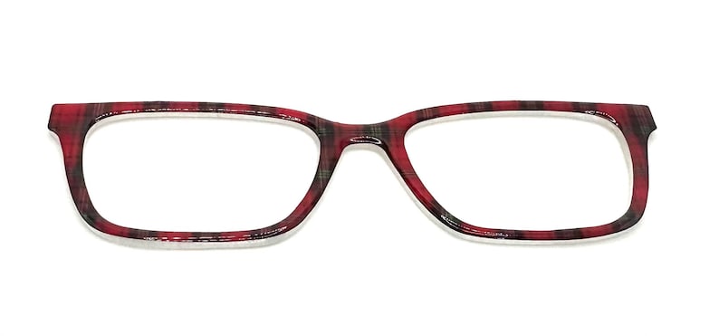 May include: Eyeglasses with a rectangular frame. The frame has a red and black plaid pattern. The lenses are clear, and the glasses are set against a white background.
