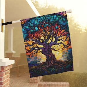 May include: A colourful stained glass style tree with a vibrant sunset background. The tree has a thick trunk and branches with a variety of colours including blue, green, purple, orange, and yellow.