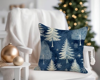 May include: A blue throw pillow with a white winter forest design. The pillow features a repeating pattern of stylised trees and snowflakes on a dark blue background.