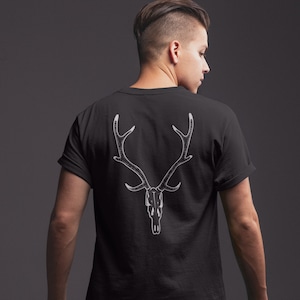 May include: Black t-shirt with a white graphic of a deer skull with antlers.