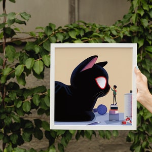 May include: A framed illustration of a large black cat with red eyes and a small person standing on a stack of books, reaching out to touch the cat's nose. The cat is lying down on a table with various art supplies.