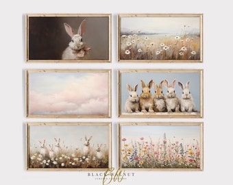 May include: Set of six framed prints featuring a variety of bunny rabbit illustrations. The prints include a single bunny with a bow, a group of four bunnies, a field of daisies, a field of wildflowers, and a sky with clouds.