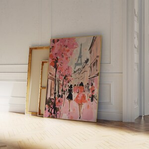 May include: A watercolor painting of a Parisian street scene with pink cherry blossoms, a view of the Eiffel Tower, and women in dresses walking down the street.