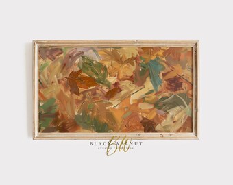 May include: Abstract painting of autumn leaves in shades of brown, yellow, green, and blue. The painting is framed in a light wood frame.