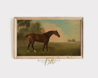 May include: A framed painting of a brown horse standing in a field. The horse is facing to the right and has a white stripe on its leg. The background is a green field with trees in the distance. The sky is blue with white clouds.