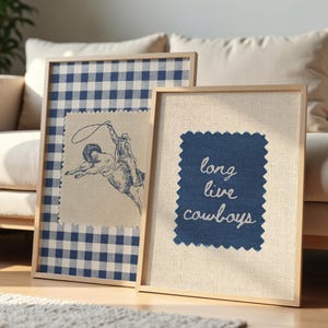 May include: Two framed art prints with a Western theme. One features a cowboy on a bucking bronco, the other reads "long live cowboys" in script. The frames are light wood, and the backgrounds are blue and white gingham and natural linen.