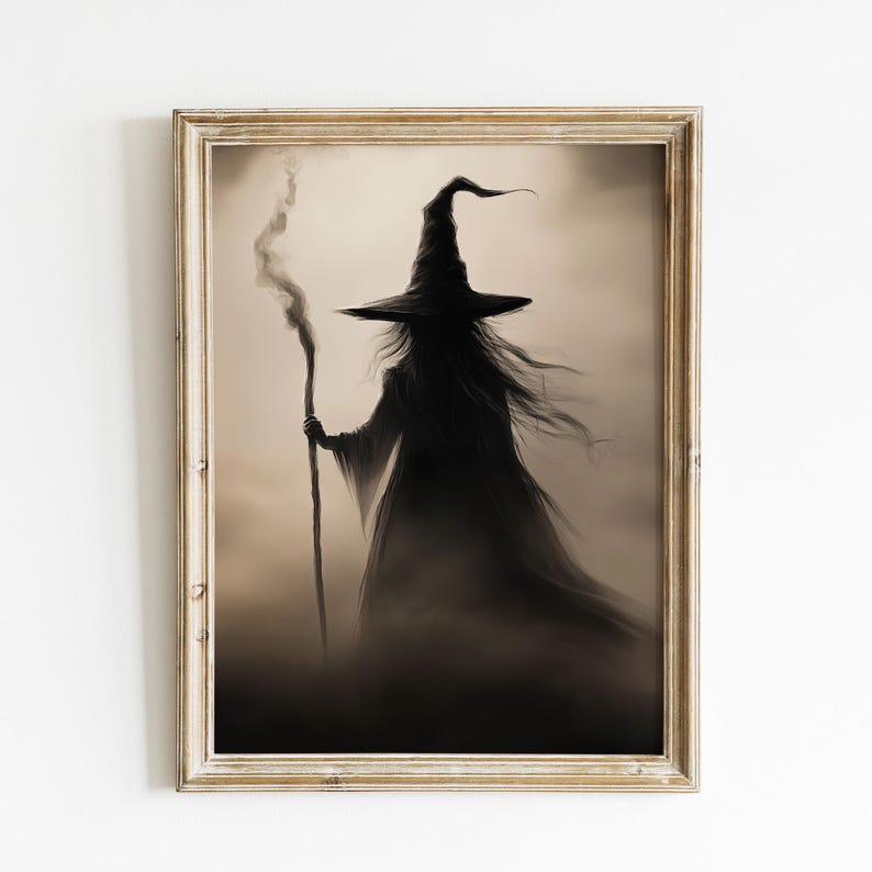 May include: A framed illustration of a witch in a pointed hat and long flowing robe, holding a staff. The witch is silhouetted against a misty background.