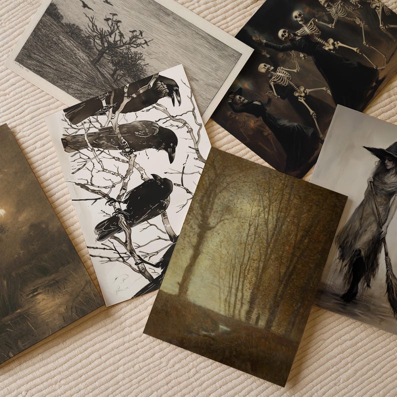 May include: A collection of rectangular art prints featuring various illustrations including a black and white drawing of three crows on bare branches, a scene with skeletons in dark clothing, a forest landscape, and a figure holding a broomstick.