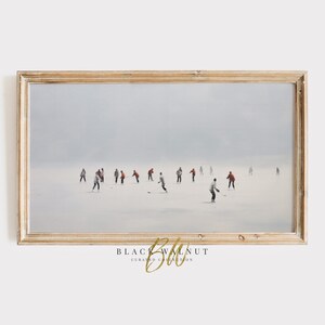 May include: A framed painting of a group of people ice skating on a snowy, foggy day. The people are wearing winter clothing and are skating in a line formation. The painting is set against a backdrop of a white, snowy landscape.