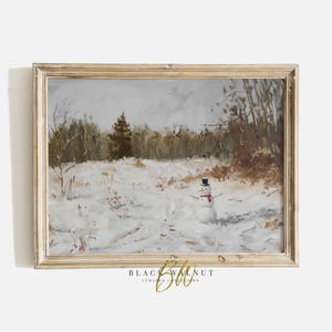 May include: A framed painting of a snowman standing in a snowy field with trees in the background. The snowman is wearing a black top hat and a red scarf.
