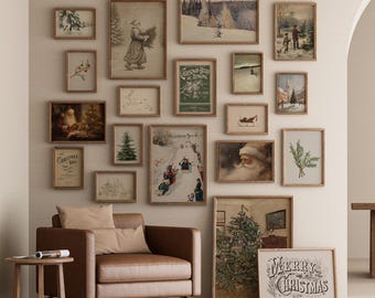 May include: A collection of framed vintage Christmas prints in various sizes and styles, arranged on a wall. The prints feature winter scenes, Santa Claus, and holiday-themed text. A brown leather armchair and side table are in the foreground.