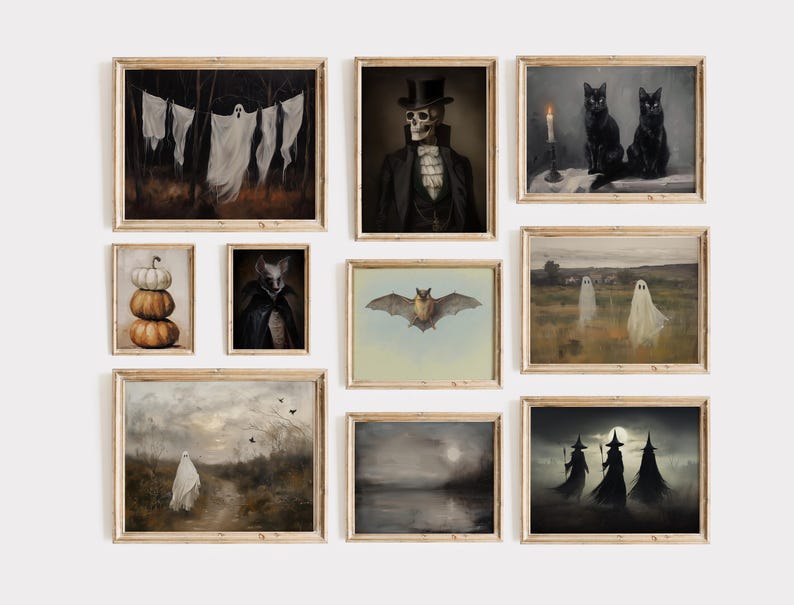 May include: A gallery wall set of ten framed art prints featuring Halloween themes including ghosts on a clothesline, a skeleton in a top hat, black cats, stacked pumpkins, a bat, a lone ghost in a field, and three witches under a full moon.