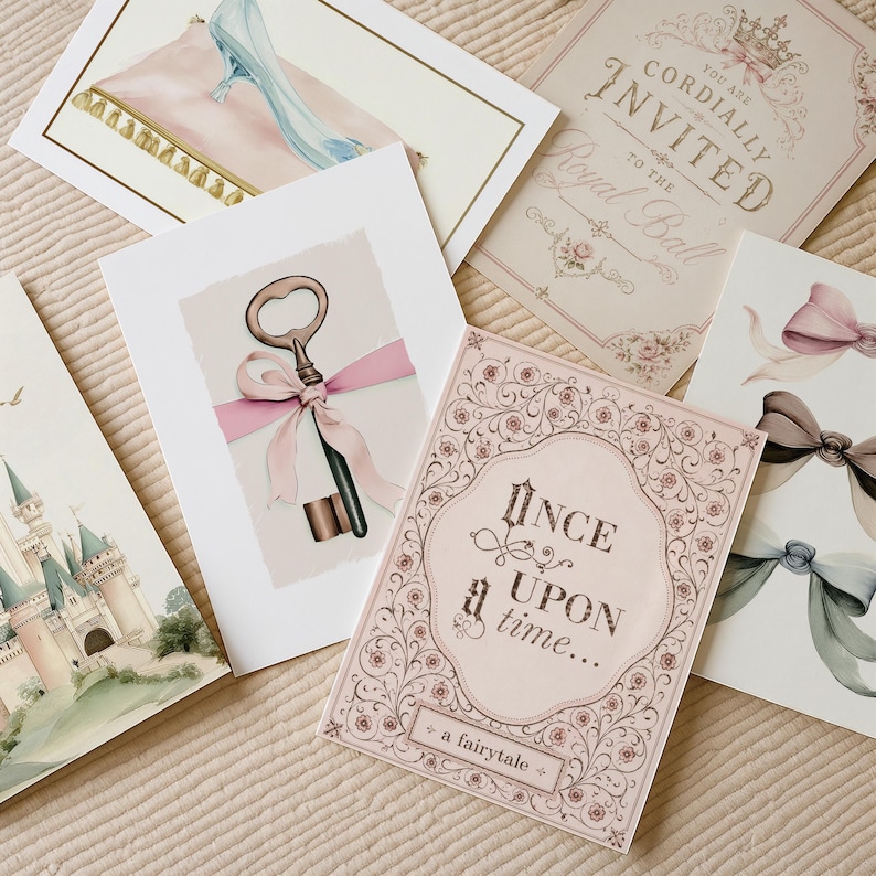 May include: A collection of five rectangular greeting cards featuring illustrations of a glass slipper on a pillow, a royal ball invitation, a key with a pink ribbon, a castle, and a card with the text Once upon a time... a fairytale.