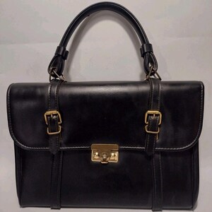 Sac cartable noir en similicuir vintage des années 1950 avec poignée supérieure, matériel en laiton
