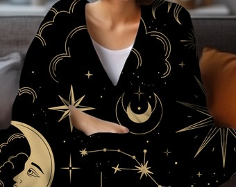 May include: A black throw blanket with a gold celestial pattern featuring moons, stars, and constellations.