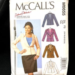 May include: McCall's sewing pattern M6655 featuring a woman wearing a light peach blazer and a brown skirt. The pattern includes illustrations of different blazer styles. The size is F5 (16-18-20-22-24).
