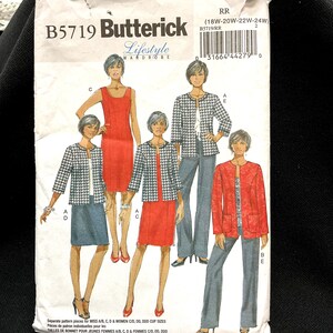 May include: Butterick B5719 Lifestyle Wardrobe sewing pattern. The pattern features illustrations of women's clothing, including jackets, dresses, and pants. The pattern includes sizes 18W-24W. The cover has a white background with text and images.