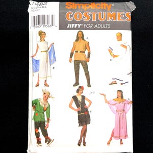 May include: Simplicity Costumes sewing pattern for adults. The package features illustrations of various costume designs, including a Roman toga, a flapper dress, and a scarecrow outfit. The text "JIFFY FOR ADULTS" is visible.