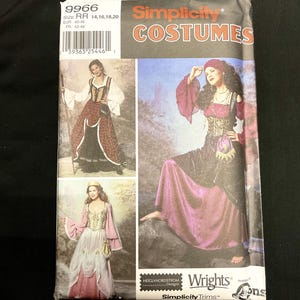 May include: Simplicity Costumes pattern featuring medieval-style dresses. The package includes images of women in various costume designs. The pattern size is RR 14, 16, 18, and 20.