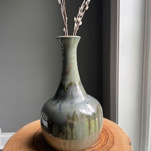 0Handmade, wheel-thrown genie vase or bottle glazed in smoky gray and brown colors. It is a perfect gift for any occasion or any home decor