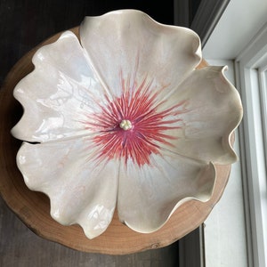 Handmade, wheel thrown, and sculpted porcelain bowl made into a hibiscus flower. It is either for the wall or table. Elegant and organic