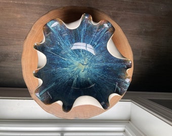 handmade porcelain ruffle bowl done on brilliant shades of blue, purple and green. It was wheel-thrown and altered to create a fluted bowl