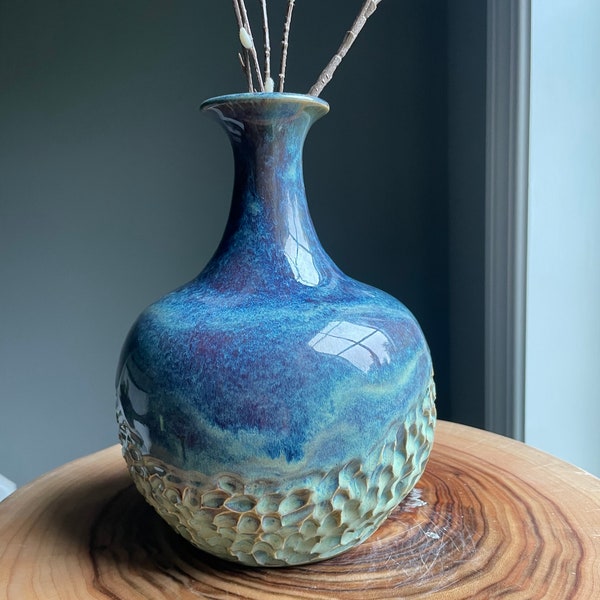 Handmade and wheel-thrown vase. Hand carved in beautiful shades of green, purple and blue.  A genie bottle for any home decor