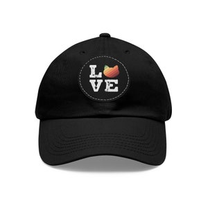 May include: Black baseball cap with a white patch that says "LOVE" and a colorful cat silhouette.