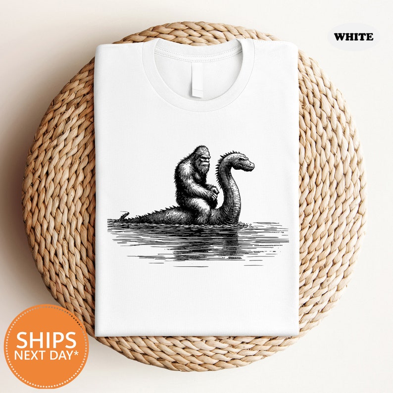 a white t - shirt with a black and white image of a gorilla and a