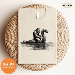 a t - shirt with a picture of a mother and baby dinosaur