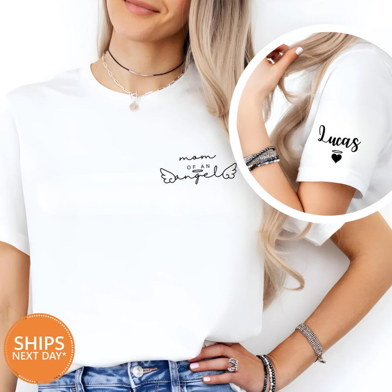 A woman wearing a white t-shirt with a personalized message and a necklace is shown in the image.