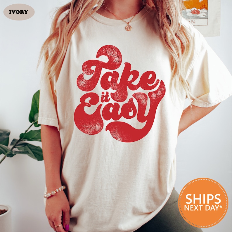 a woman wearing a fake is easy t - shirt