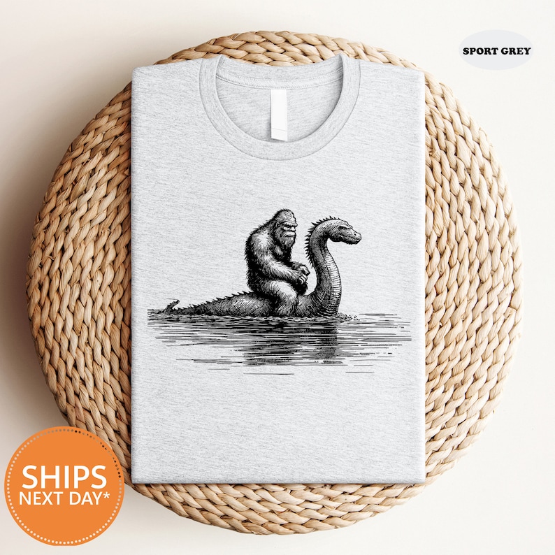 a t - shirt with a picture of a gorilla and a bird on it