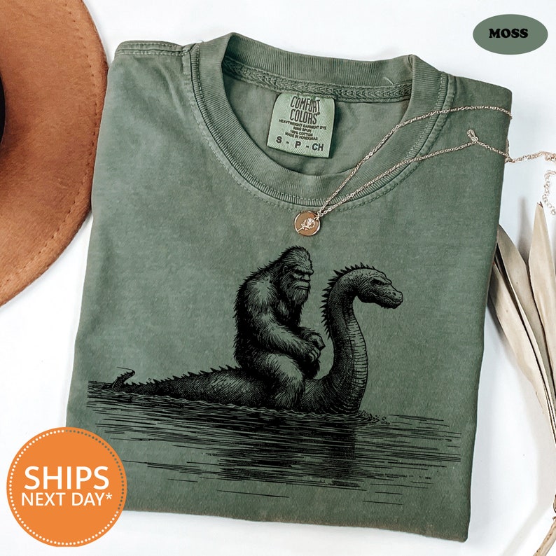 a green t - shirt with a picture of a gorilla on it