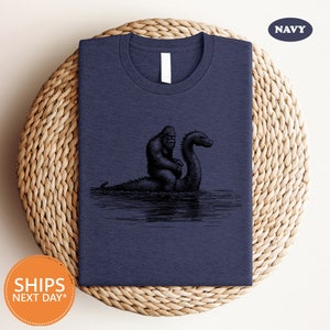 a t - shirt with a picture of a black swan on it