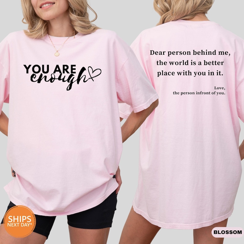 a woman wearing a pink shirt that says, you are beautiful