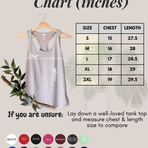 May include: A size chart for tank tops in inches. The chart shows the chest and length measurements for sizes S, M, L, XL, and 2XL. The chart is printed on a white background with a gray tank top hanging on a hanger in the background.