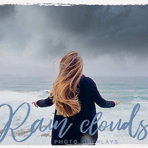 May include: A woman with long, flowing blonde hair stands on a cliff overlooking a stormy ocean. The sky is filled with dark, dramatic clouds. The text "Rain clouds PHOTO OVERLAYS" is written in a cursive font at the bottom of the image.