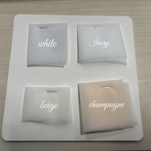 May include: Four fabric swatches labeled "white", "ivory", "beige", and "champagne".