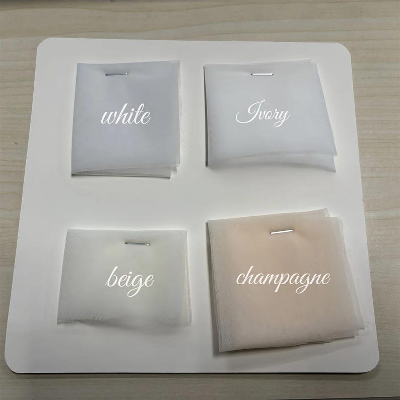May include: Four fabric swatches labeled "white", "ivory", "beige", and "champagne".