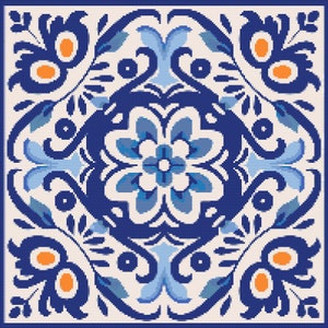 May include: Square tile with a symmetrical floral design in shades of blue, light blue, and orange on a cream background. The tile features a border and a central flower motif, with stylized leaves and swirls.